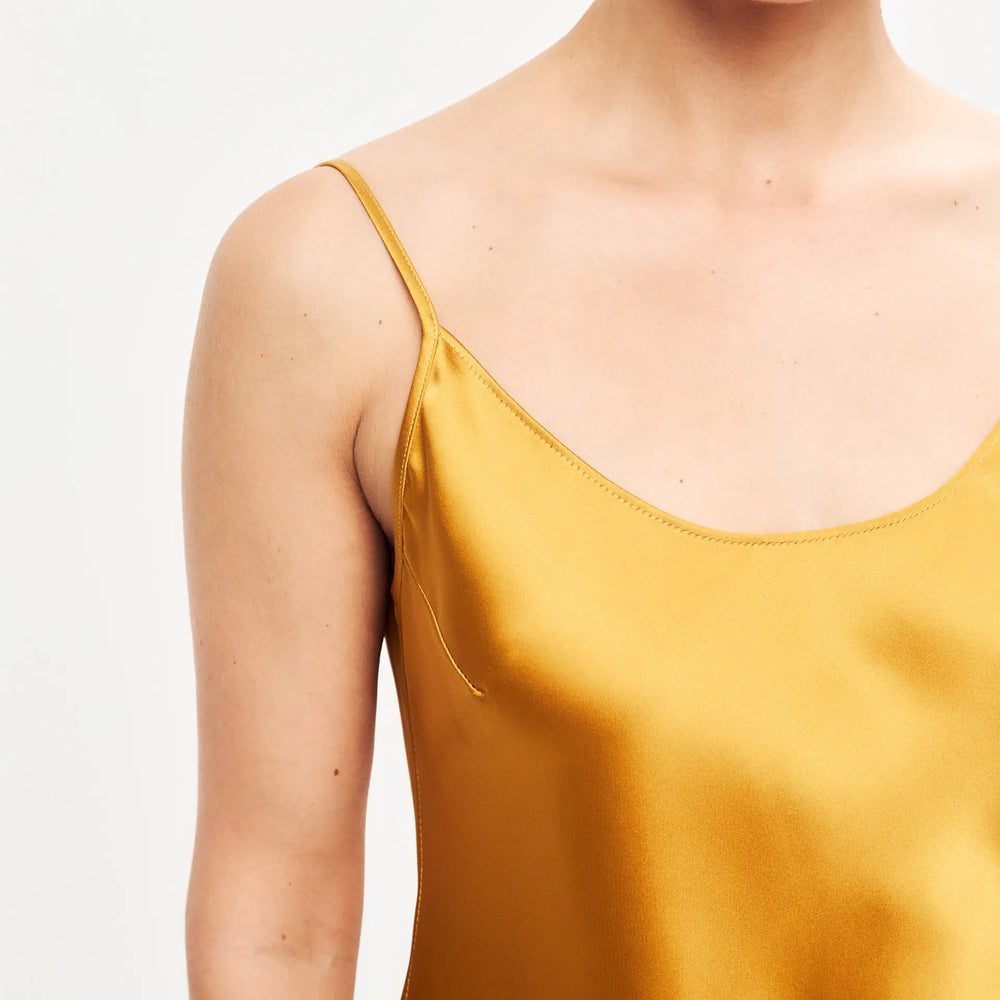 
                  
                    Dark gold mini satin slip dress ’Pure’
                  
                