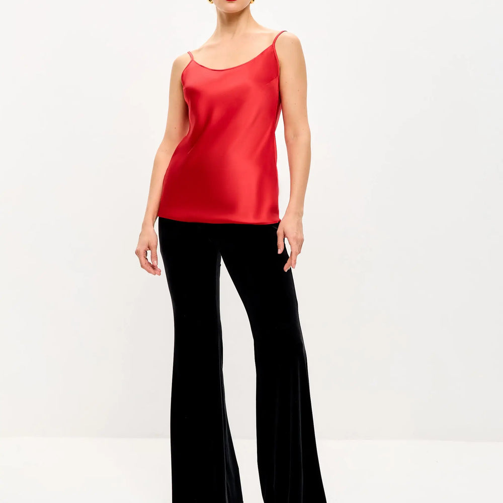 Woman in red top and black pants.